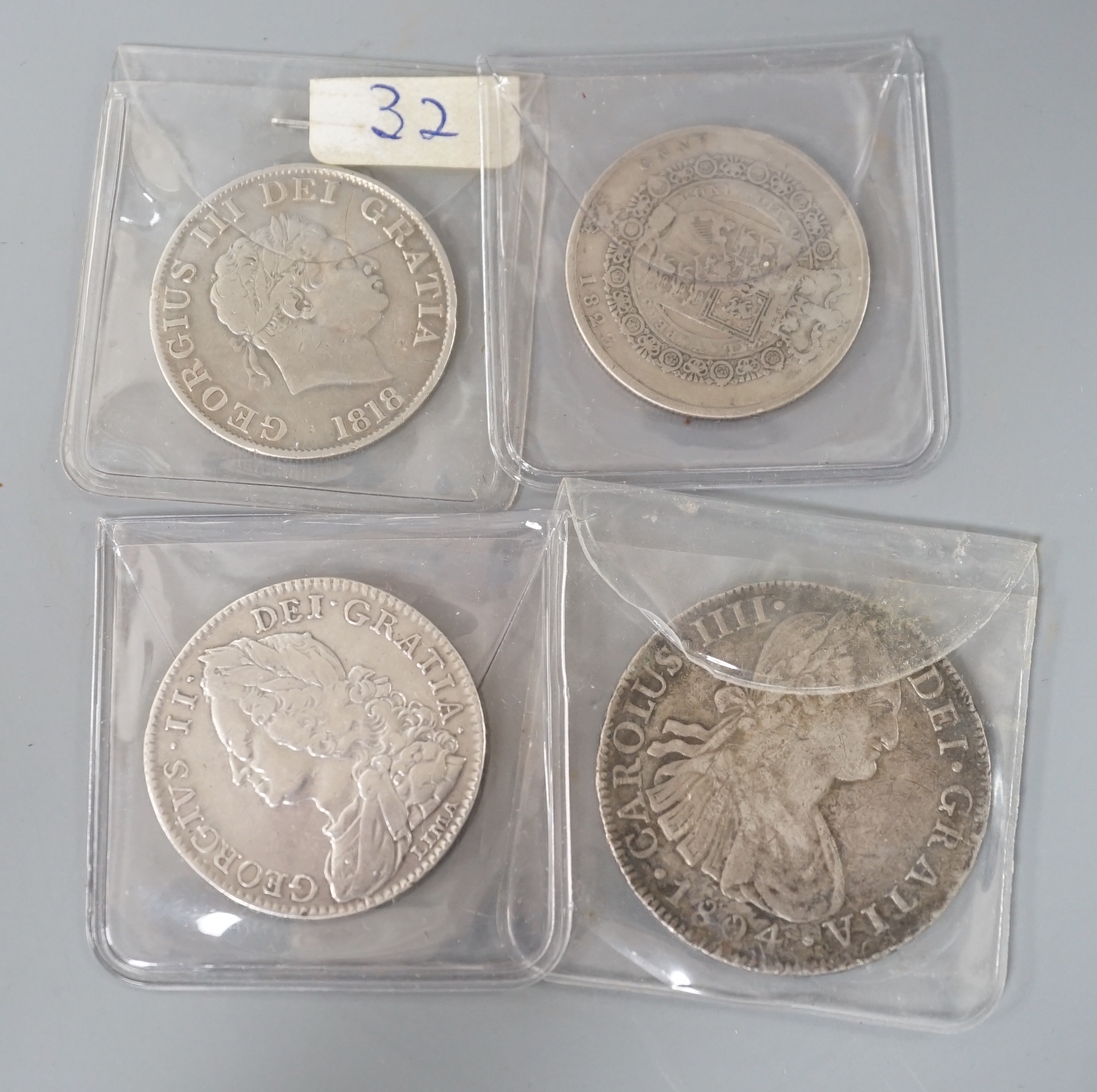 Three Georgian half crowns; 1746, 1818 & 1823 and two other coins.